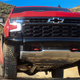 close-up shot of the front end of a red 2023 chevy silverado zr2